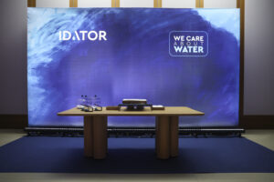 Κοπή πρωτοχρονιάτικης πίτας 2026. Απεικόνιση backdrop με branding IDATOR